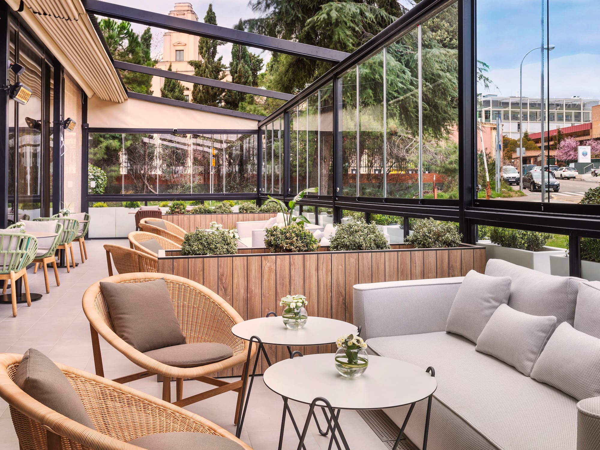 a patio with a couch and chairs