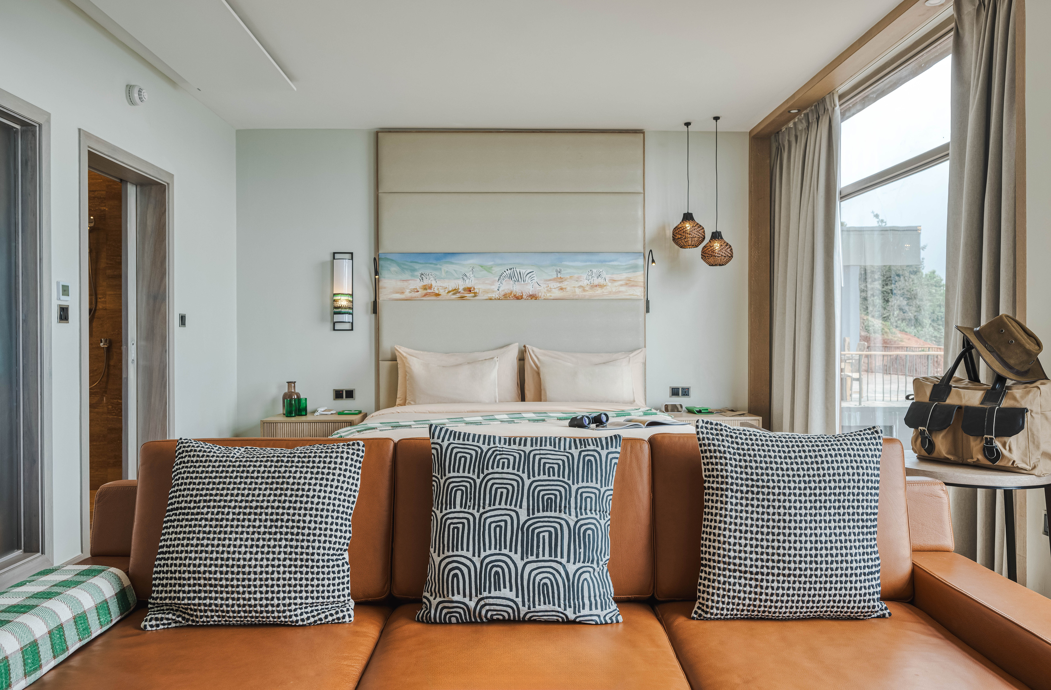 a couch with pillows in a room