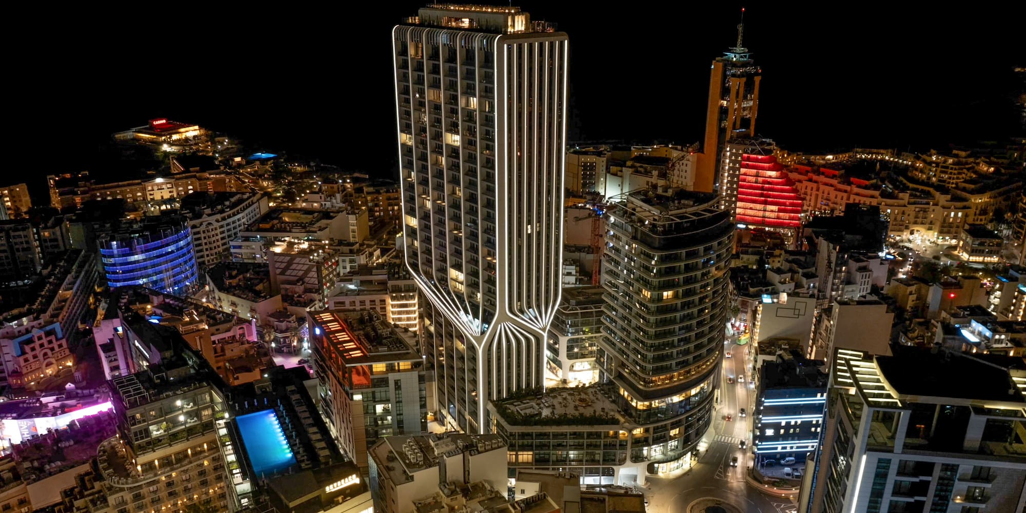 a city with many tall buildings at night