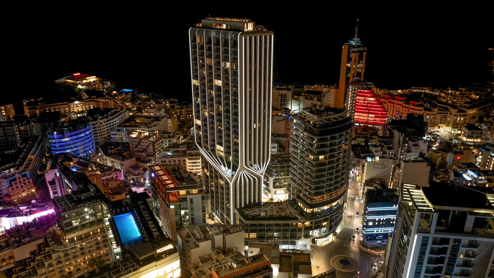 a city with many tall buildings at night