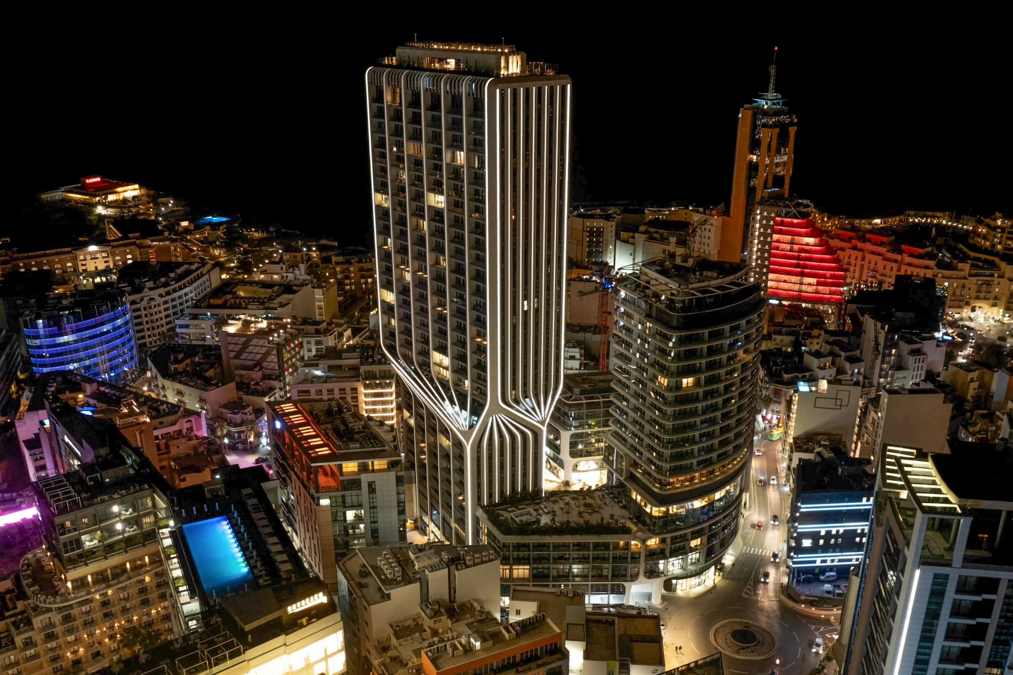 a city with many tall buildings at night