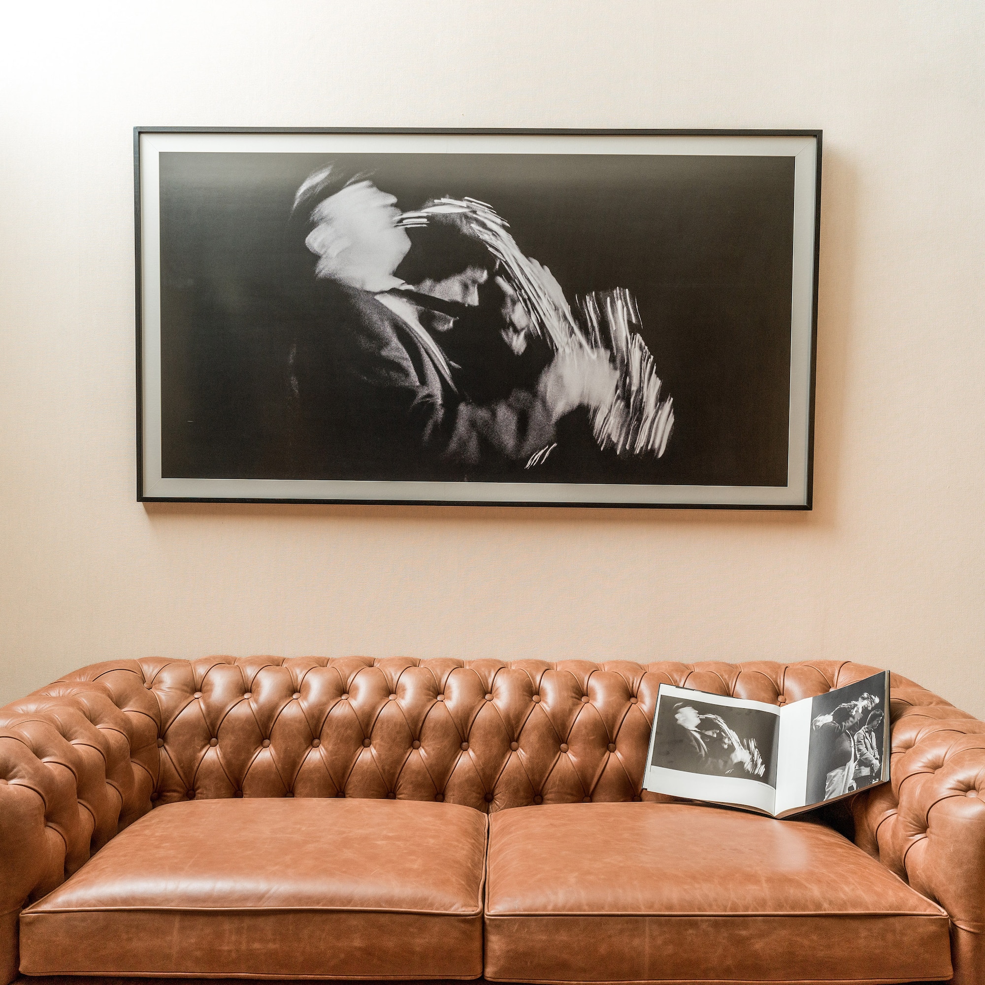 a couch with a picture on the wall