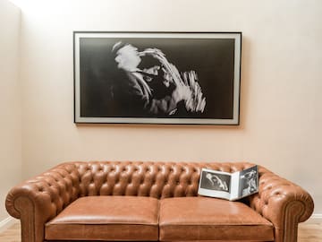 a couch with a picture on the wall