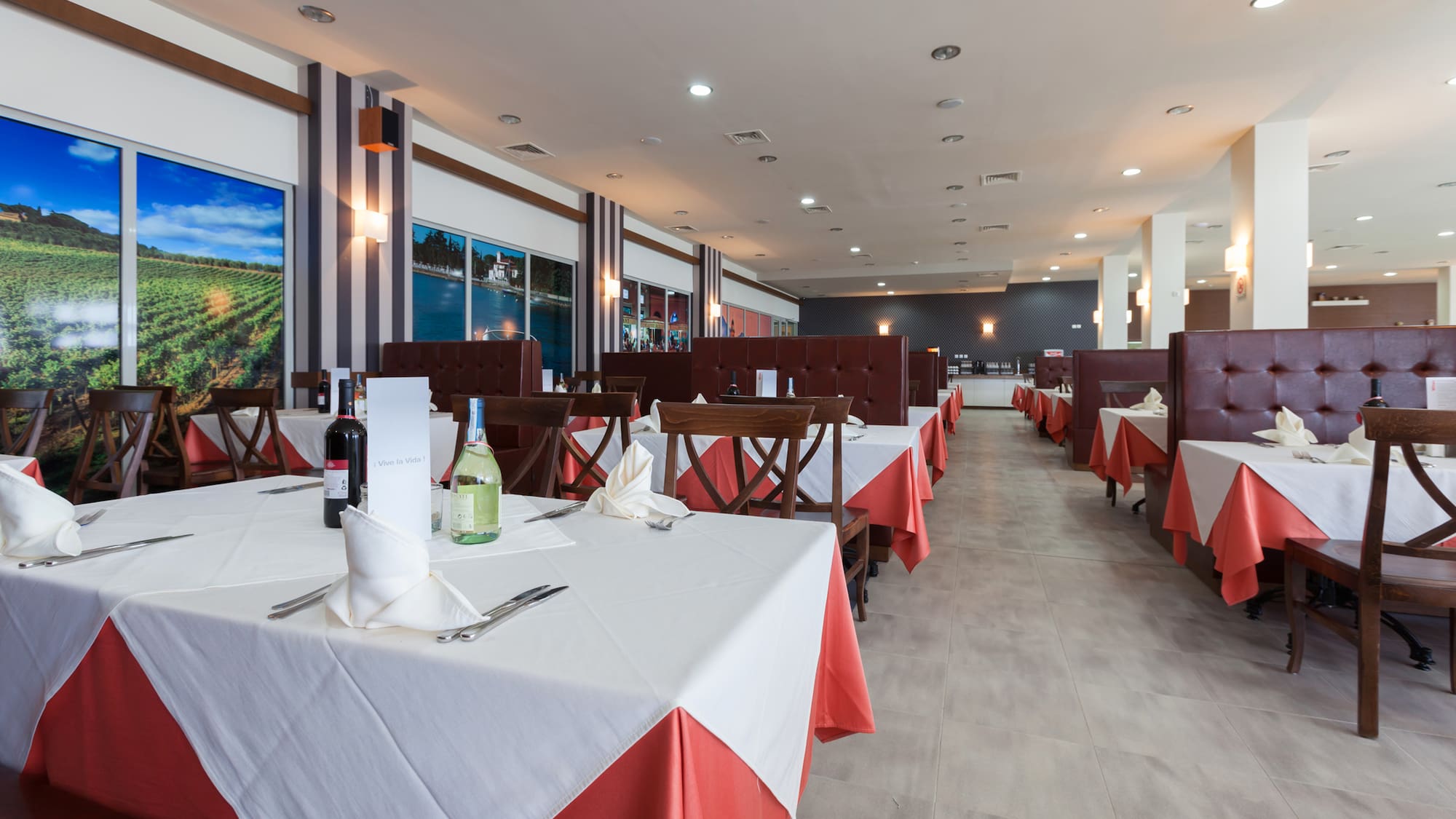 a restaurant with tables and chairs