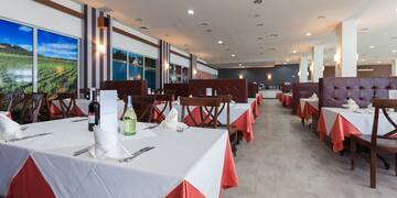 a restaurant with tables and chairs