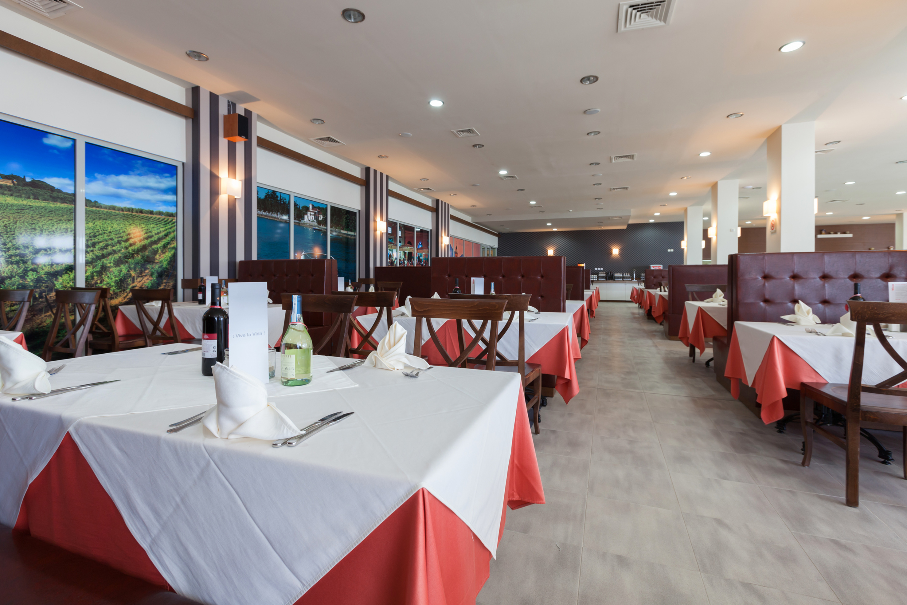 a restaurant with tables and chairs - Osteria la Spiaggia, Cucina italiana - SOL Luna Bay, Obzor