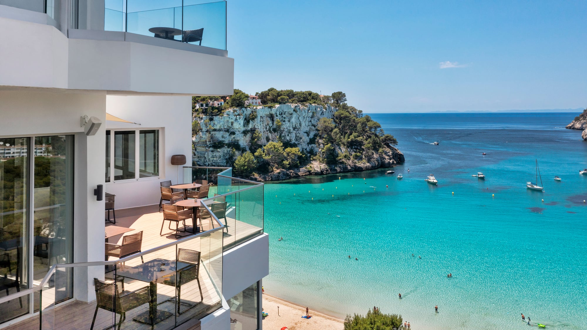 a building with a beach and a body of water