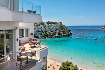 a building with a beach and a body of water