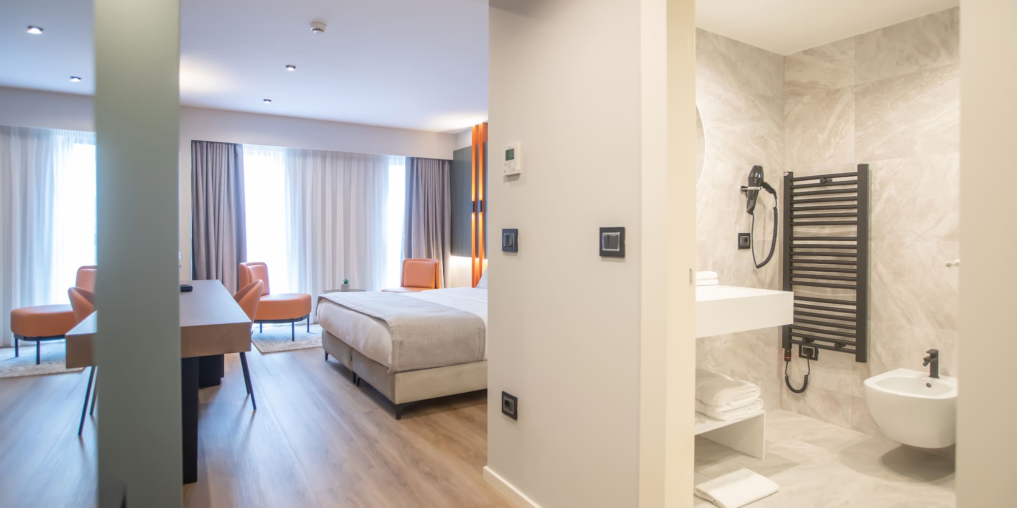 a room with a bed and a sink