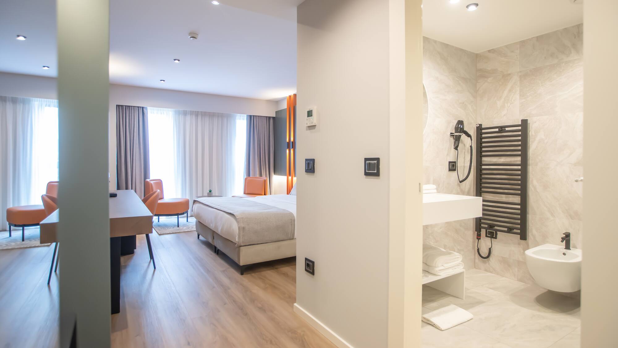 a room with a bed and a sink