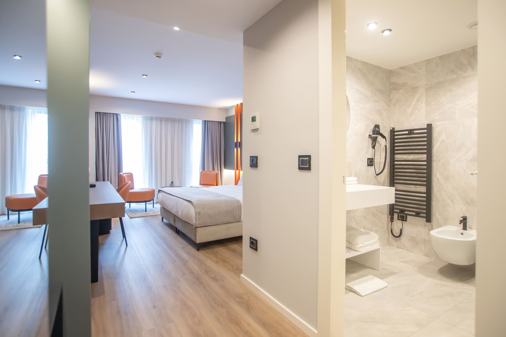 a room with a bed and a sink