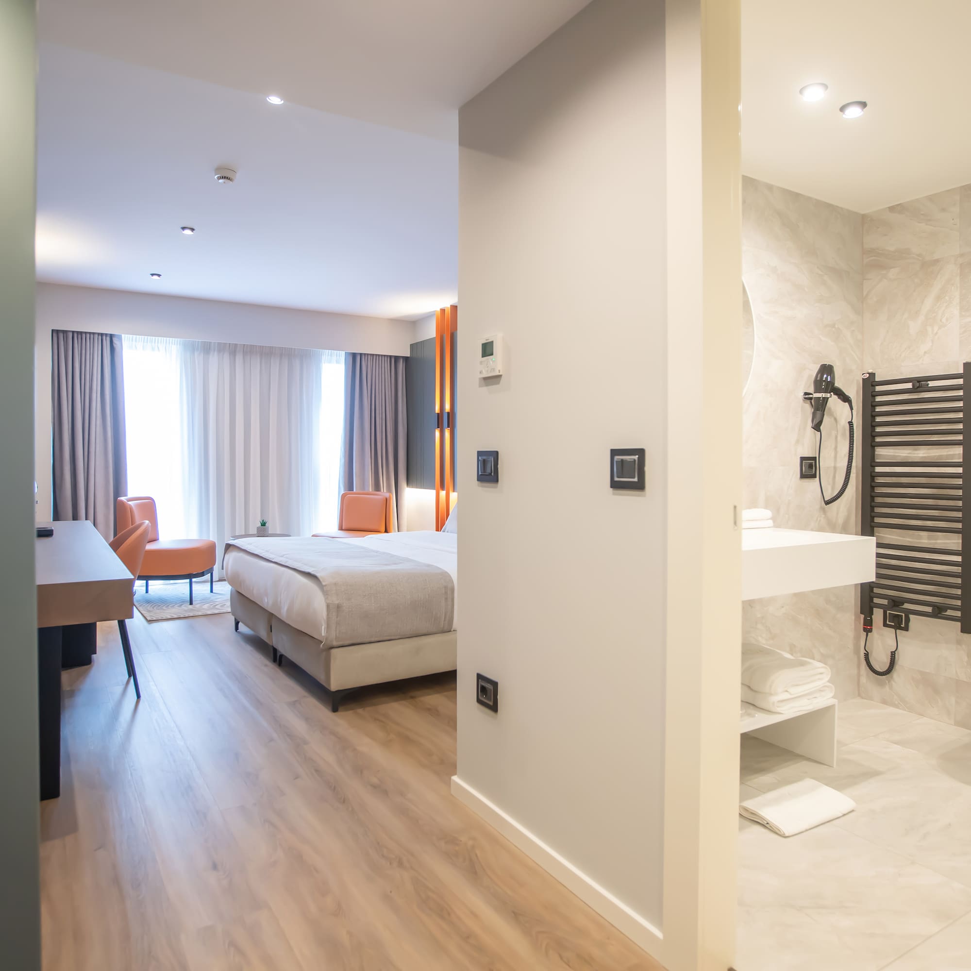 a room with a bed and a sink