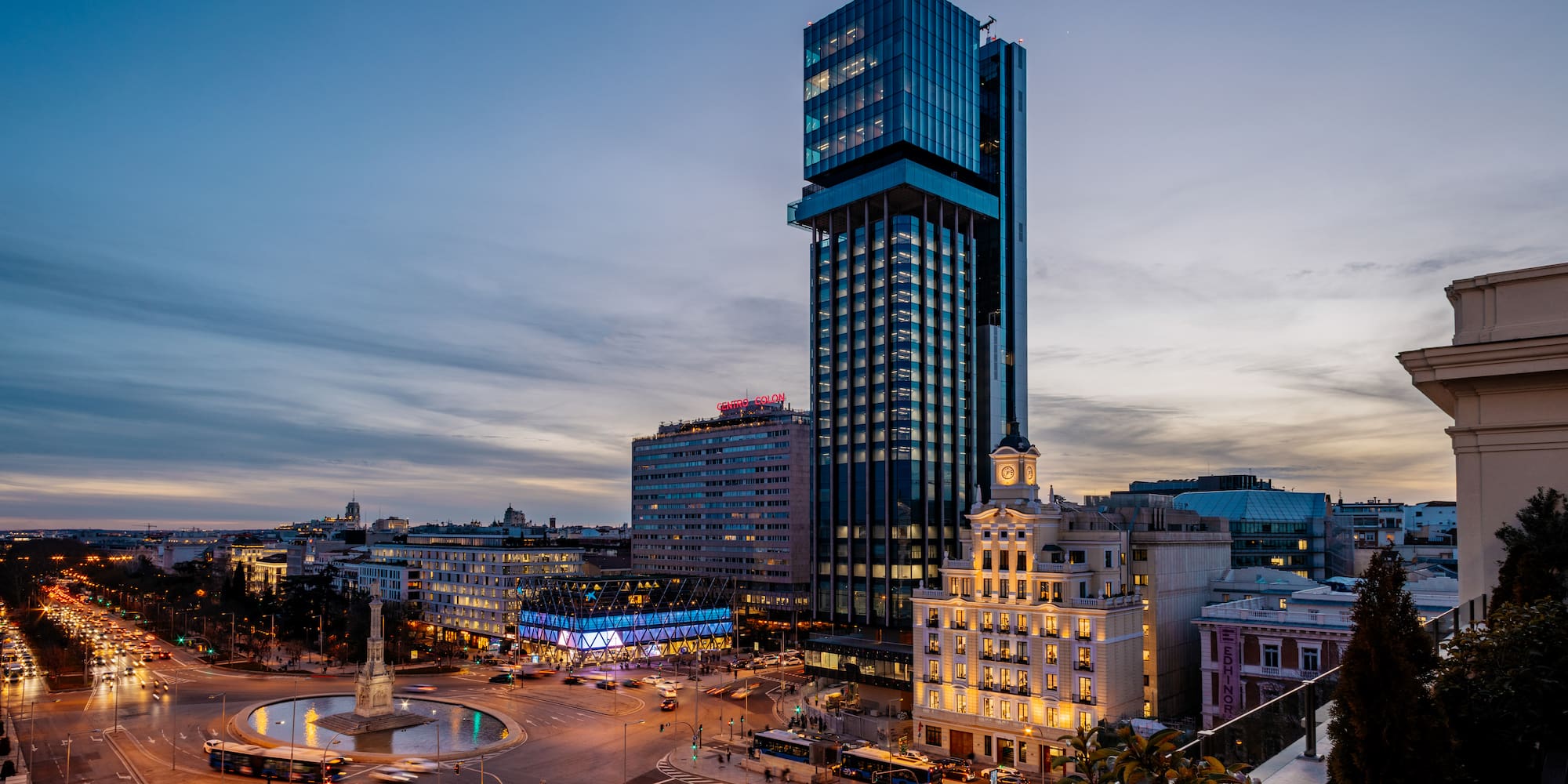 a city with a fountain and buildings