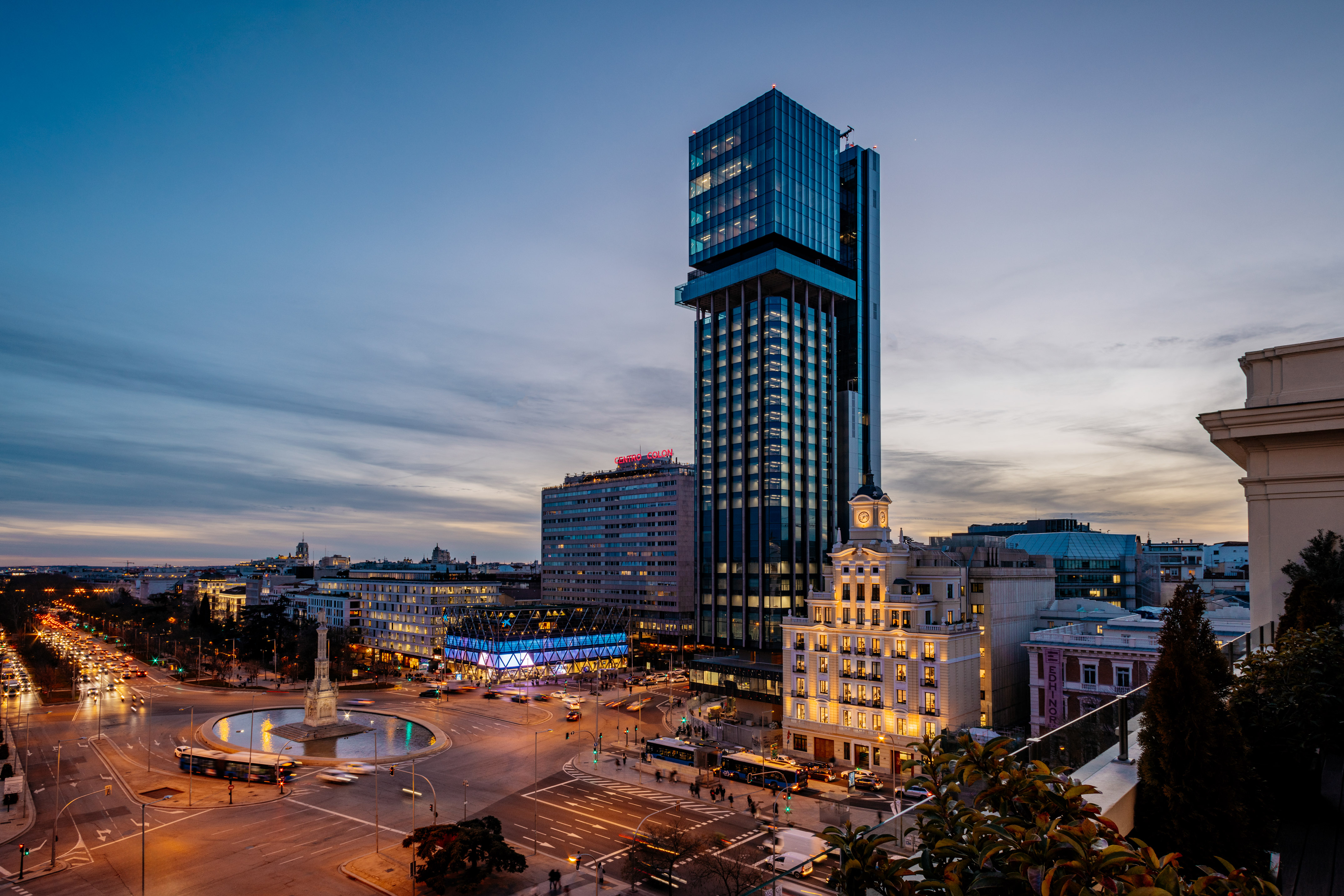 Madrid skyline at dusk, Torre de Colón skyscraper, Plaza de Colón roundabout.