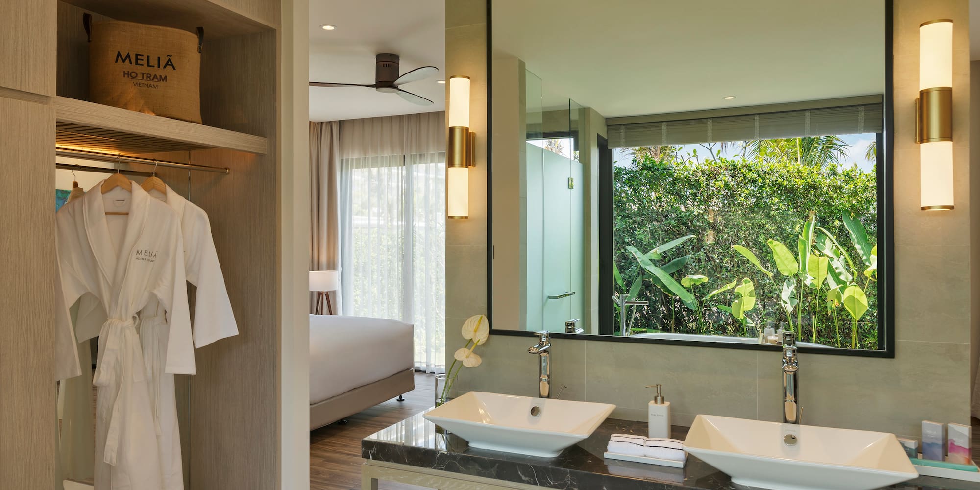 a bathroom with a large mirror and two sinks
