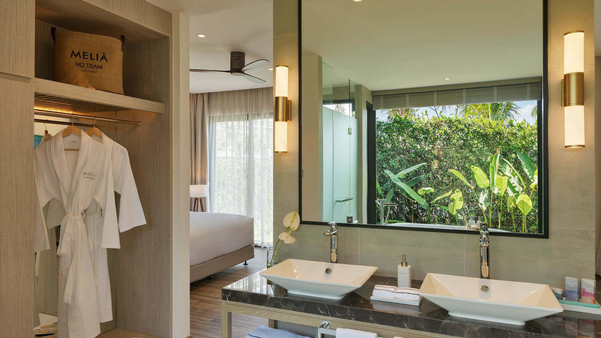 a bathroom with a large mirror and two sinks