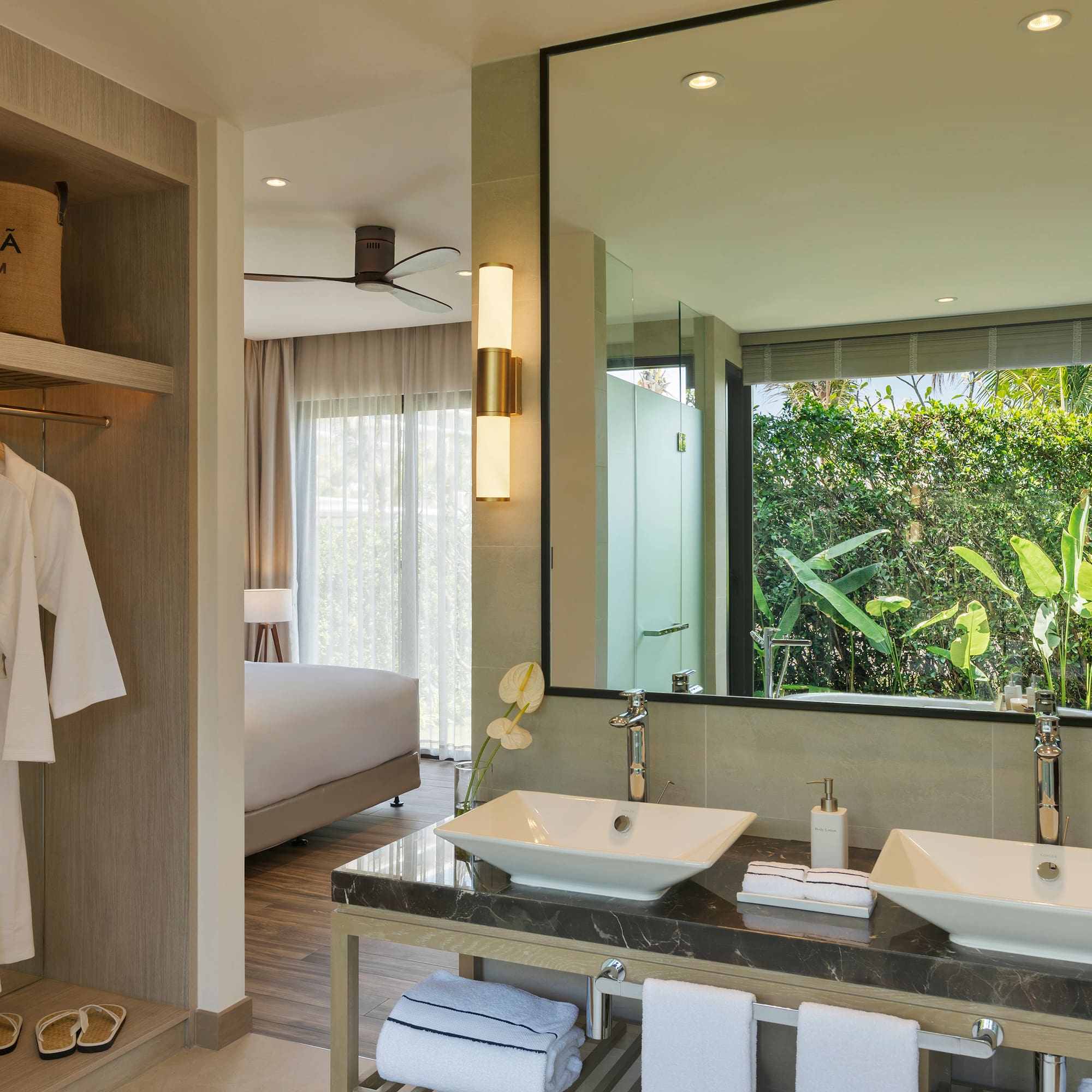 a bathroom with a large mirror and two sinks