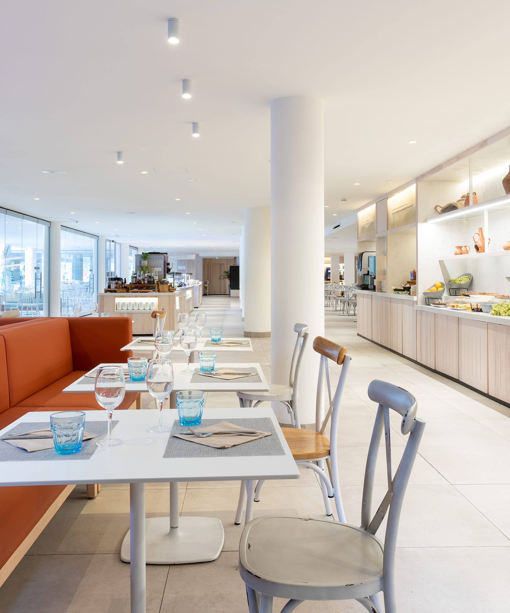 a restaurant with tables and chairs