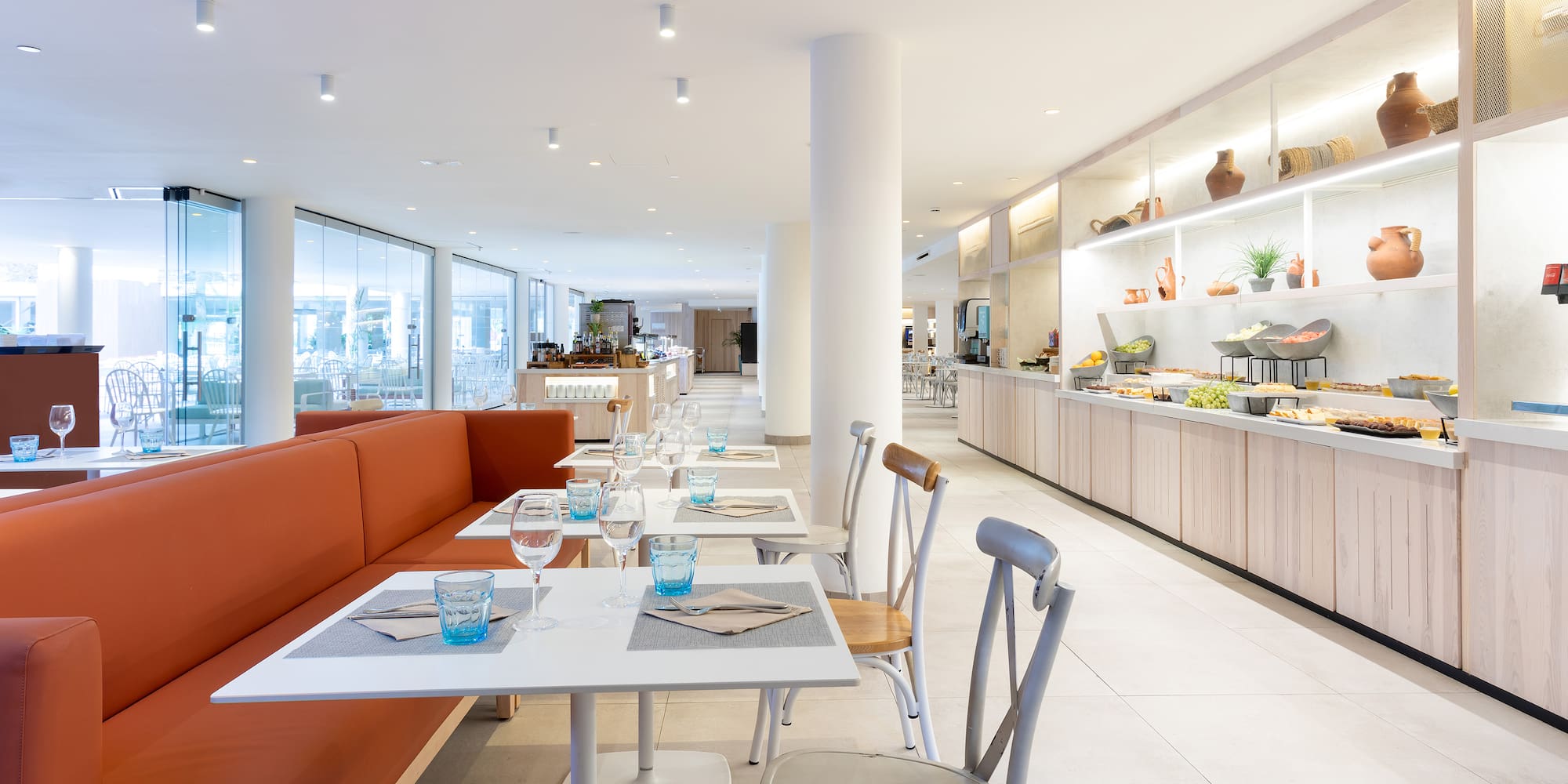 a restaurant with tables and chairs