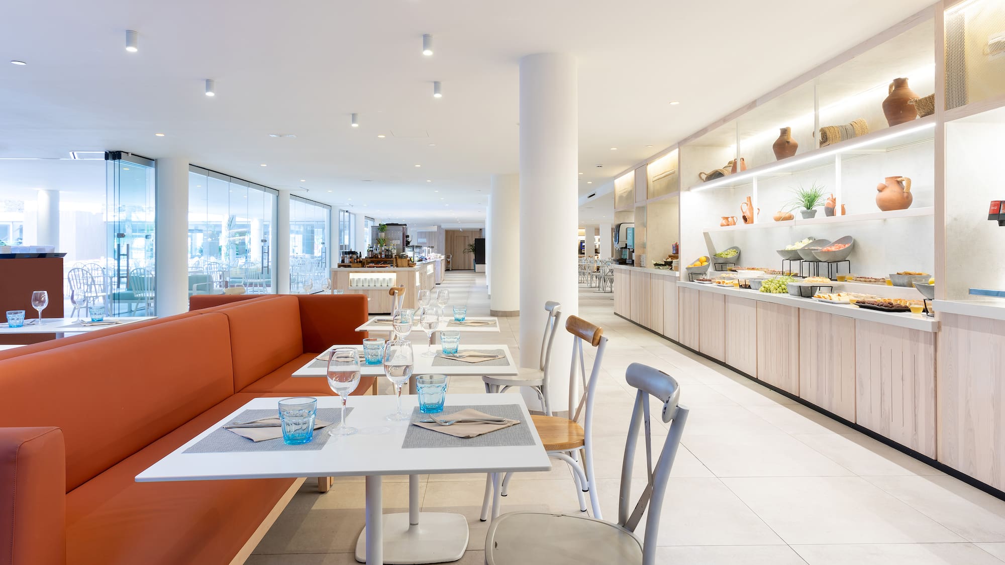 a restaurant with tables and chairs