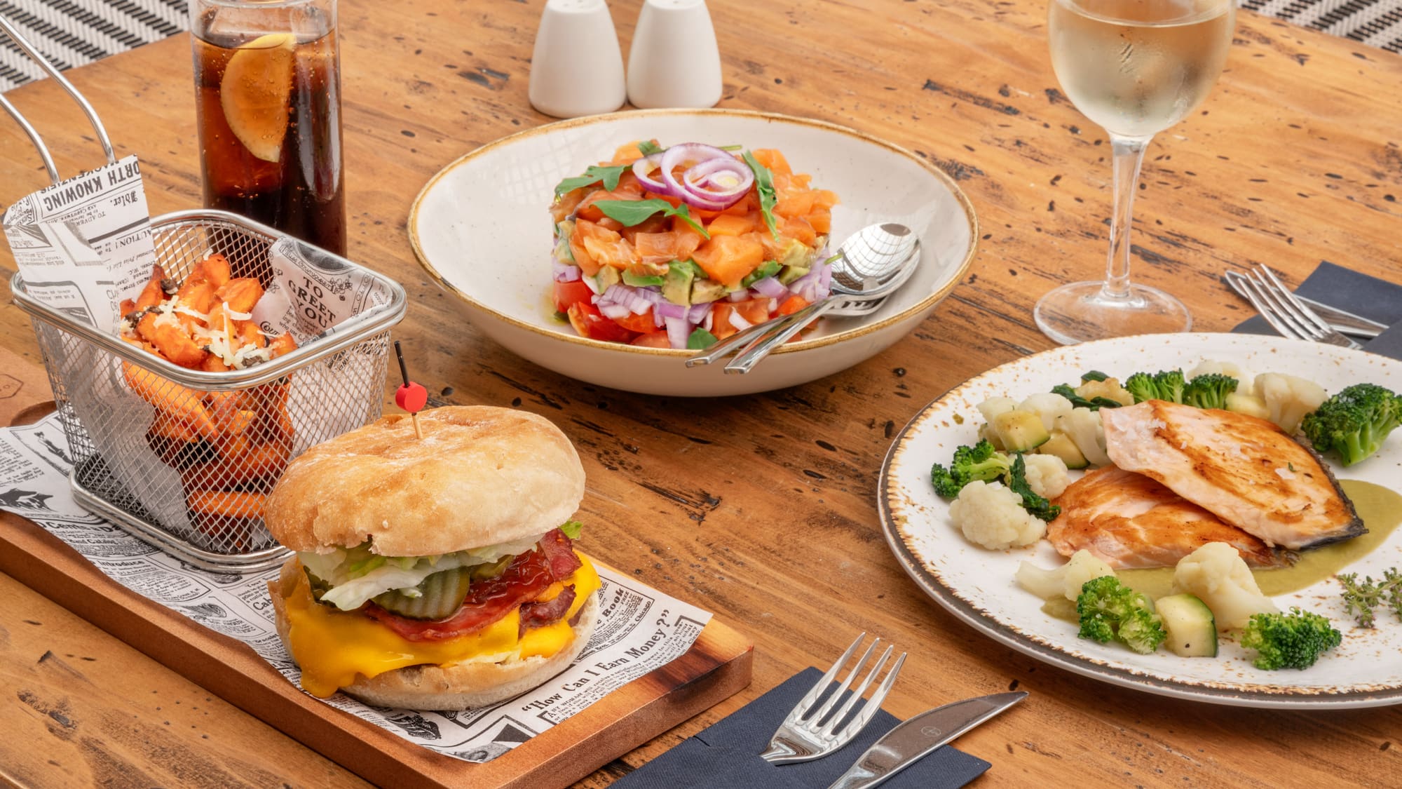 a table with plates of food and a drink