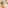 Hotel welcome bag: wicker tote with green towels and Paradises tag.