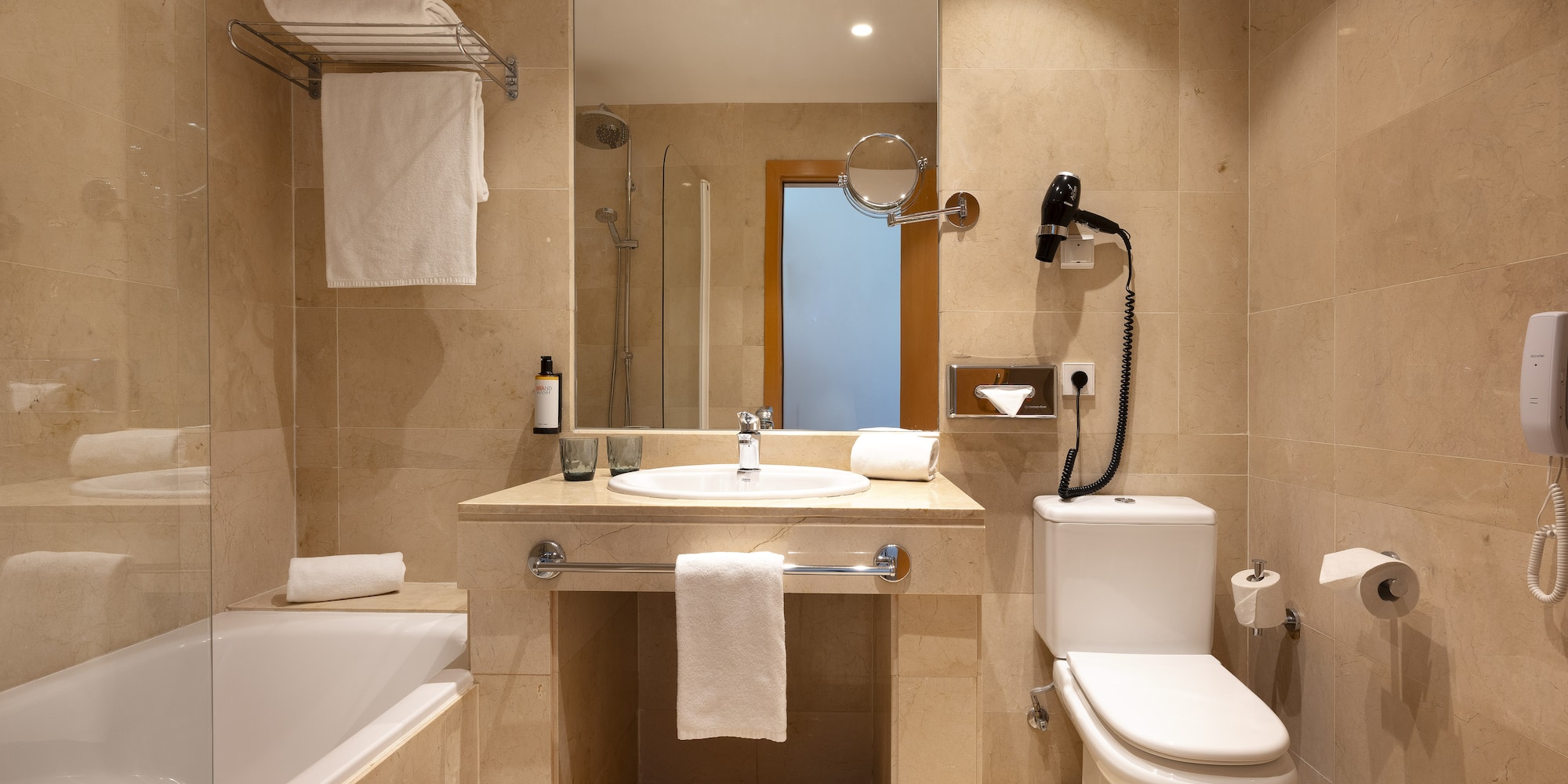 a bathroom with a sink toilet and bathtub