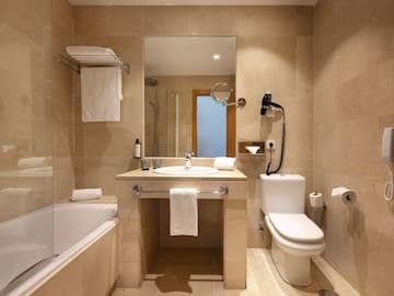 a bathroom with a sink toilet and bathtub