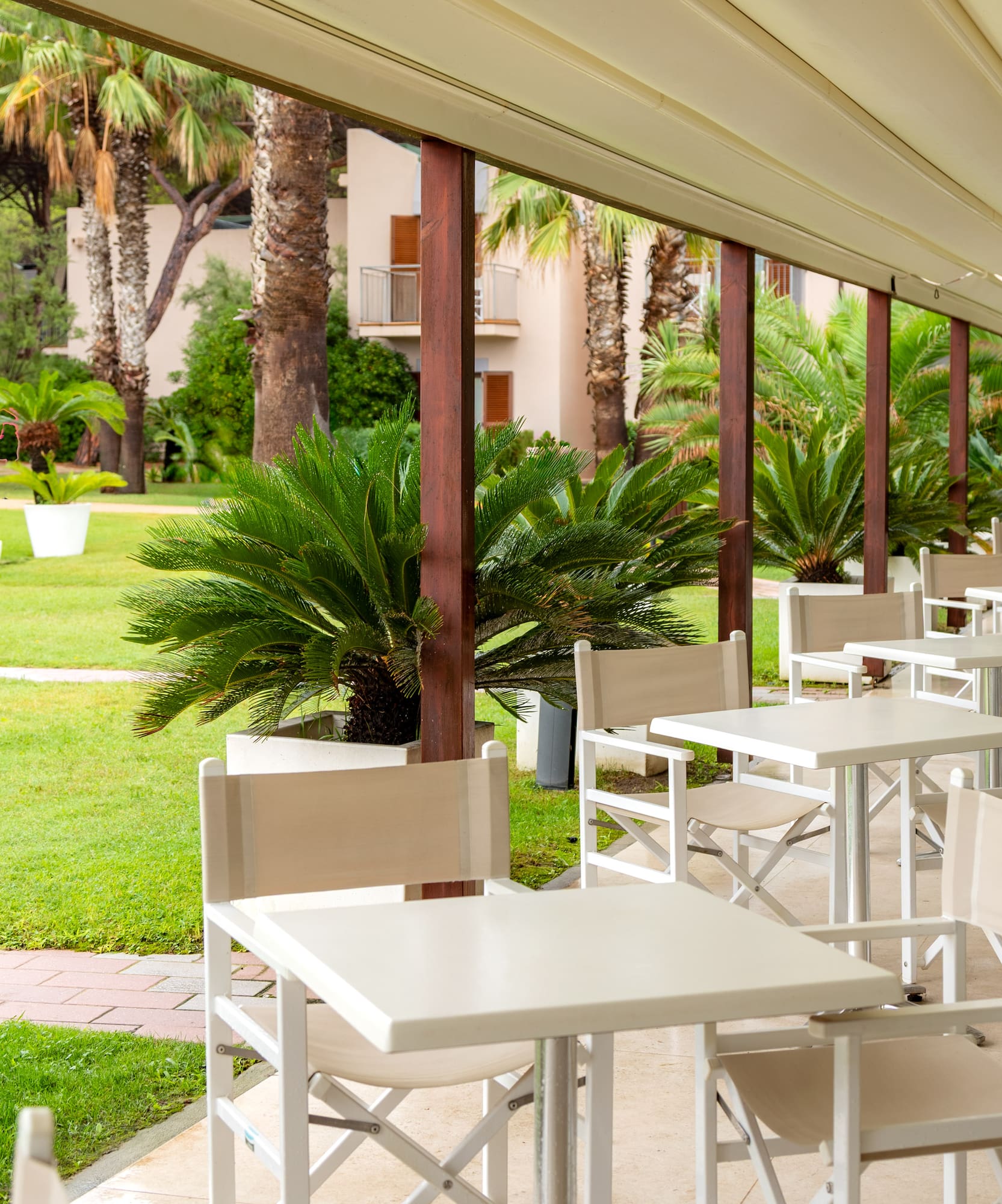 a white tables and chairs on a patio