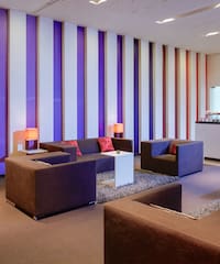 a room with purple and white striped walls
