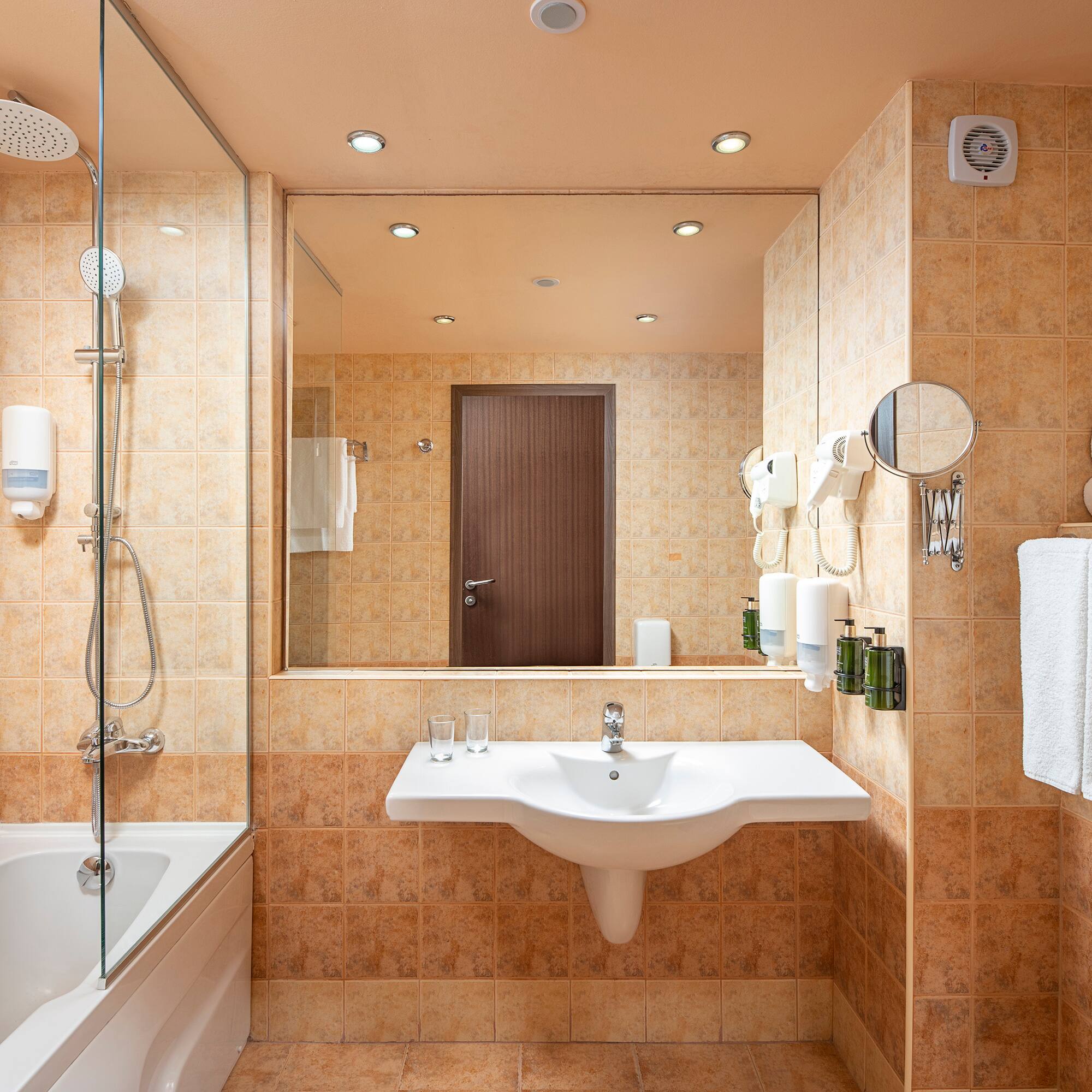 a bathroom with a sink and a shower
