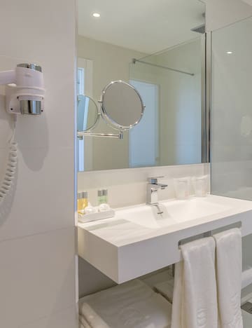 a bathroom with a mirror and a sink