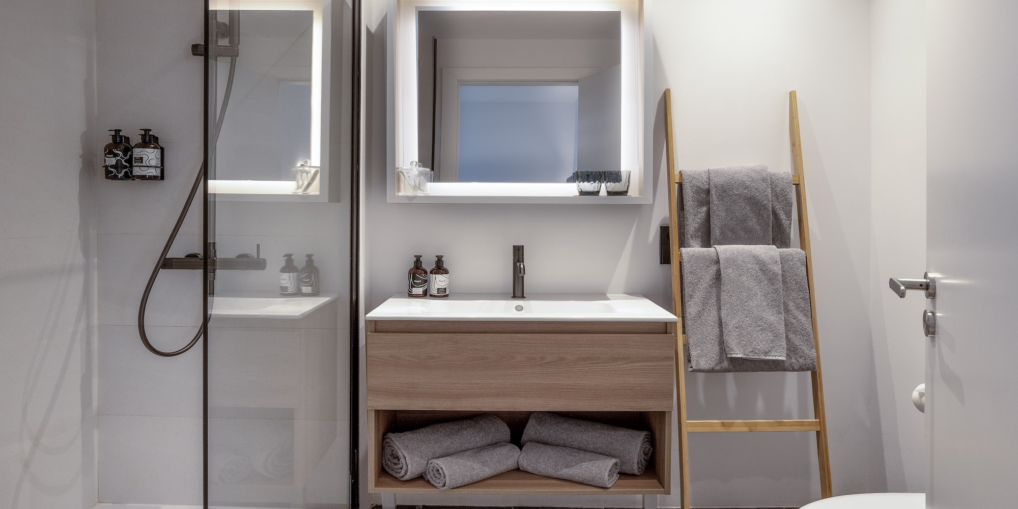 a bathroom with a mirror and sink