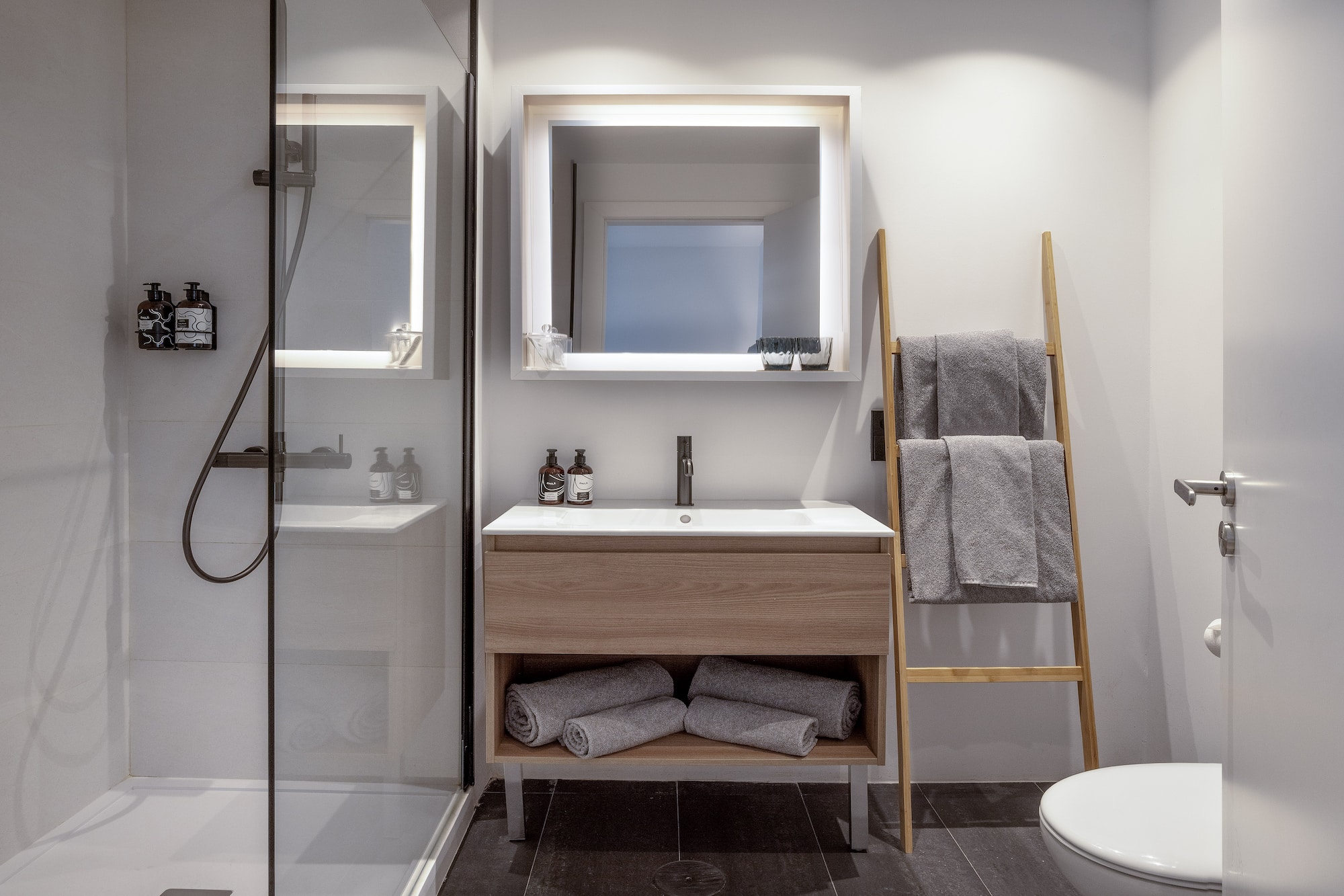 a bathroom with a mirror and sink