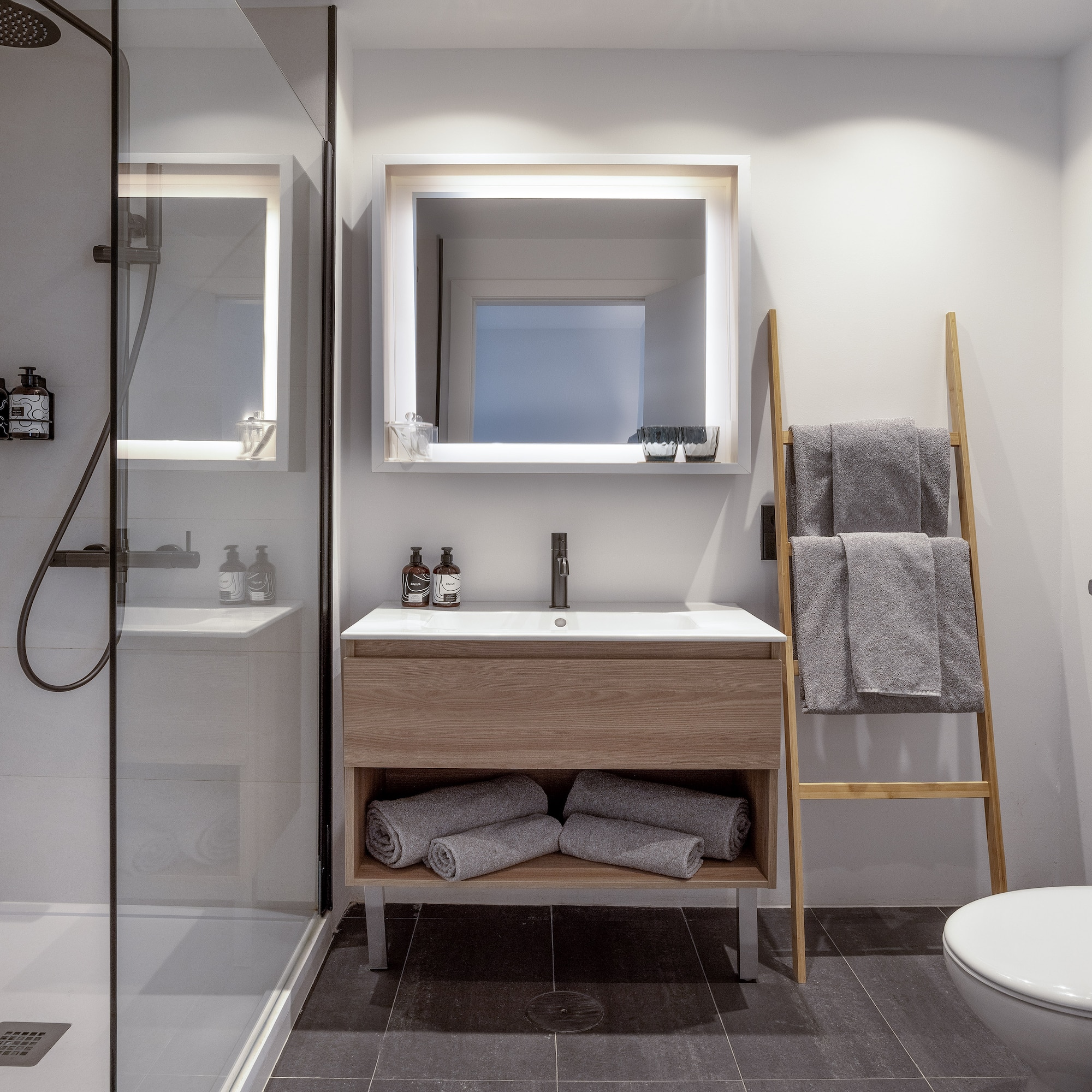 a bathroom with a mirror and sink