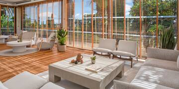 a room with a couch and chairs