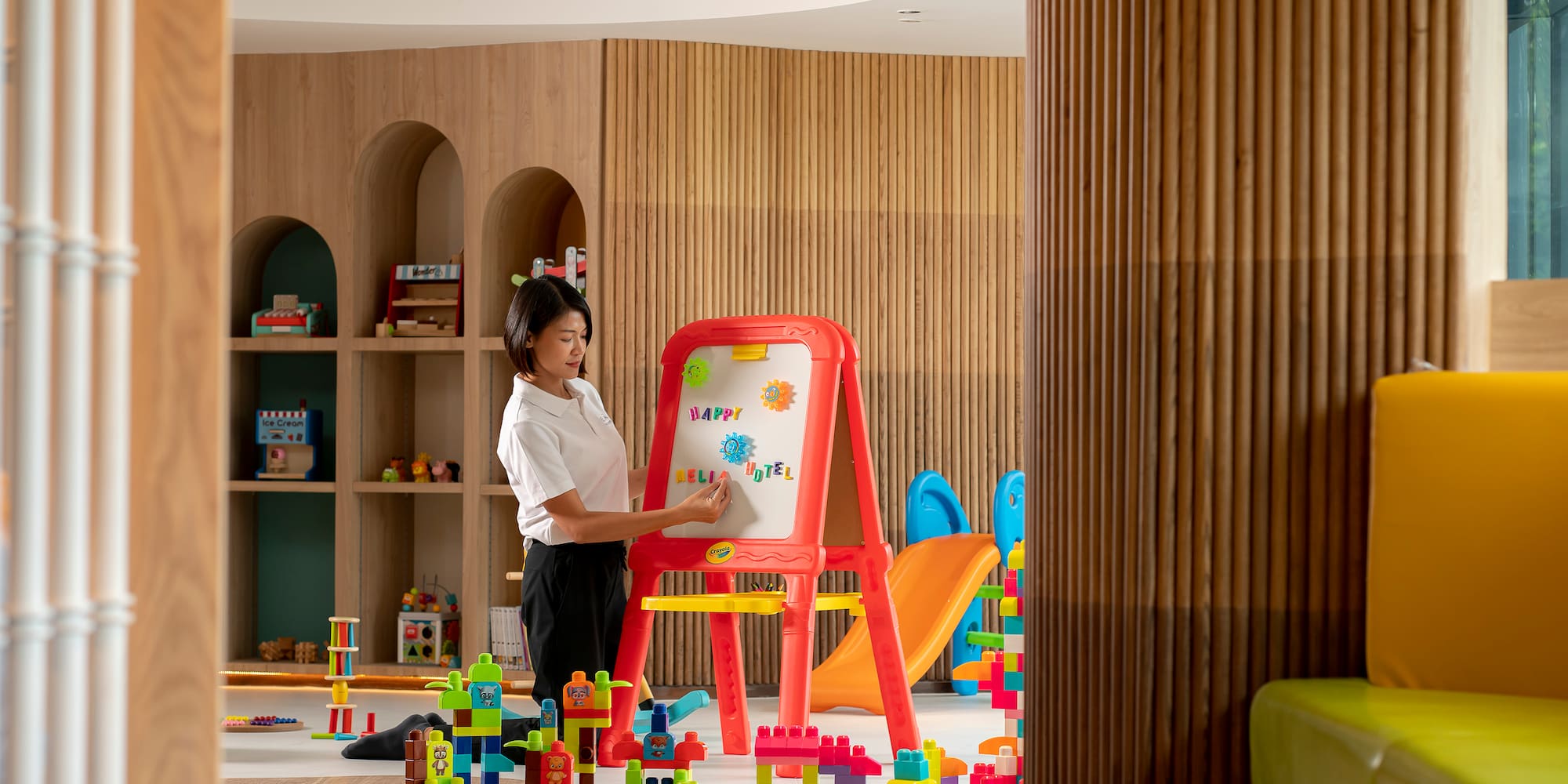 a woman drawing on a board