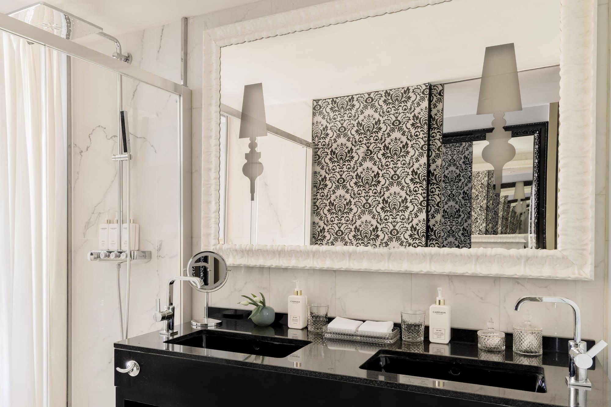 a bathroom with a mirror and a sink