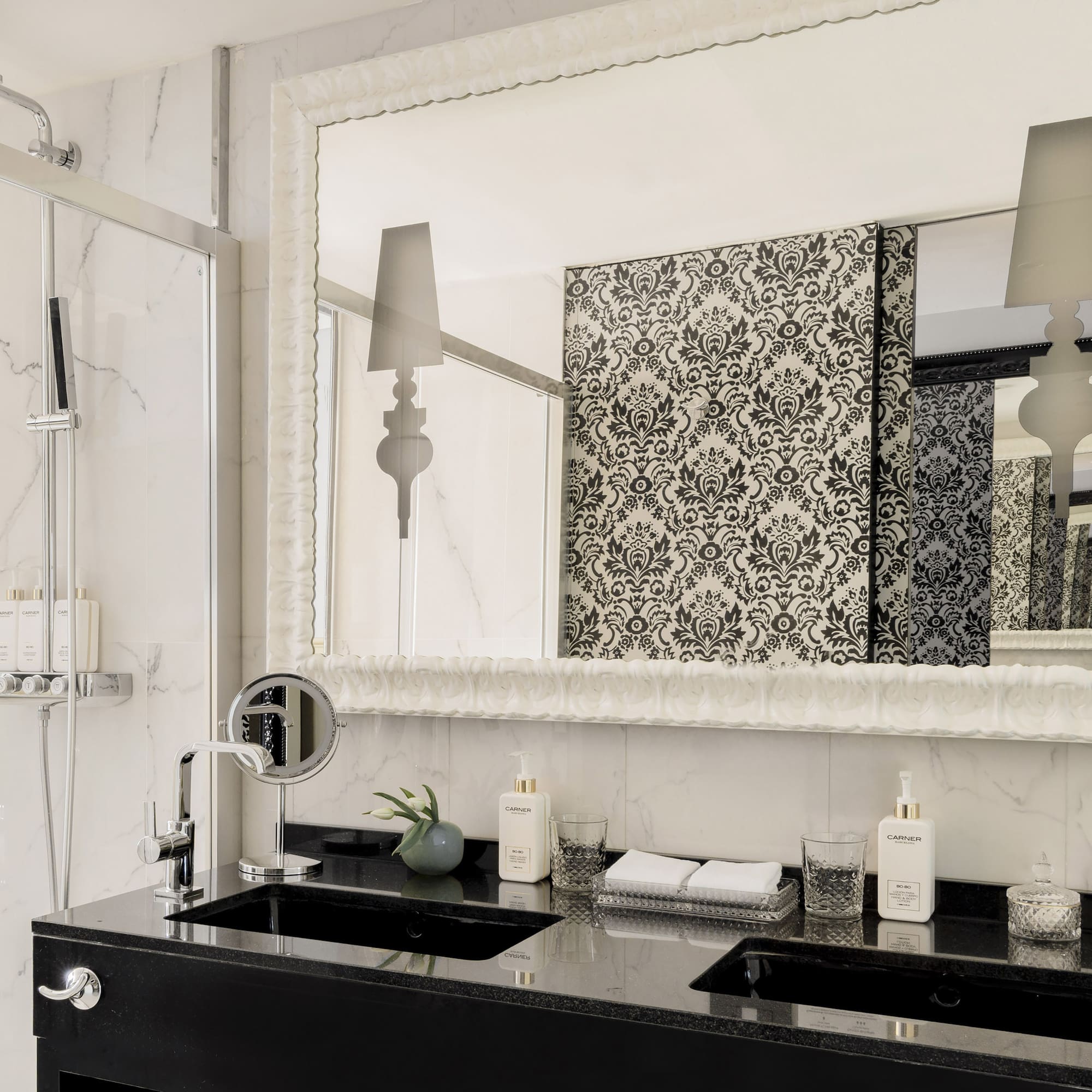 a bathroom with a mirror and a sink