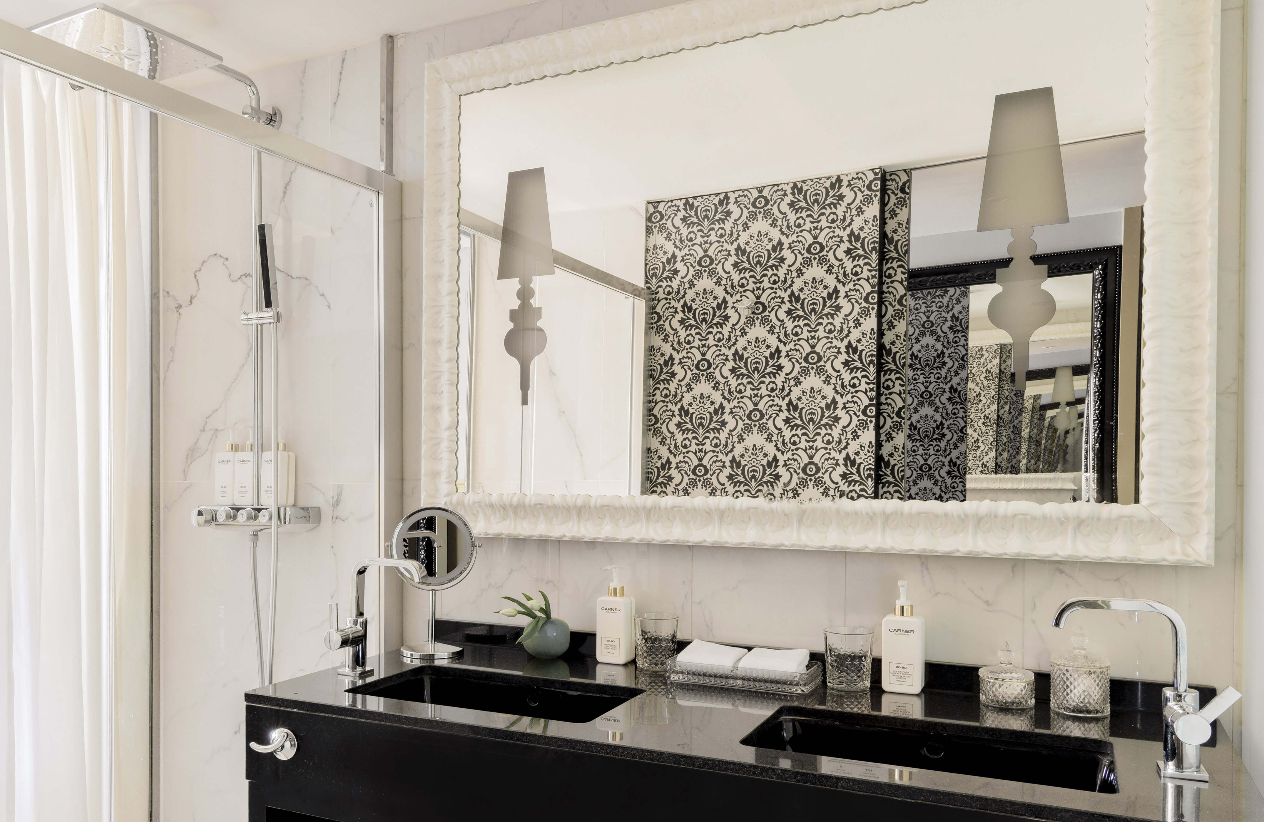 a bathroom with a mirror and a sink