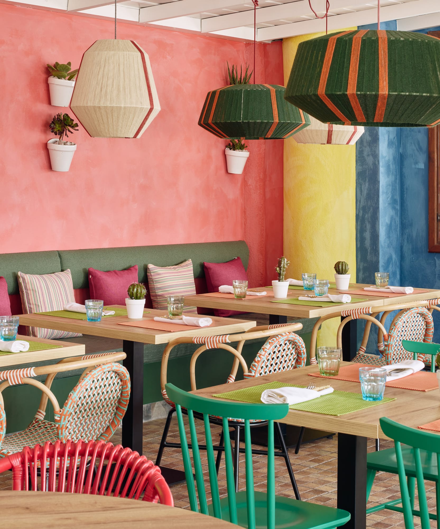 a colorful restaurant with tables and chairs