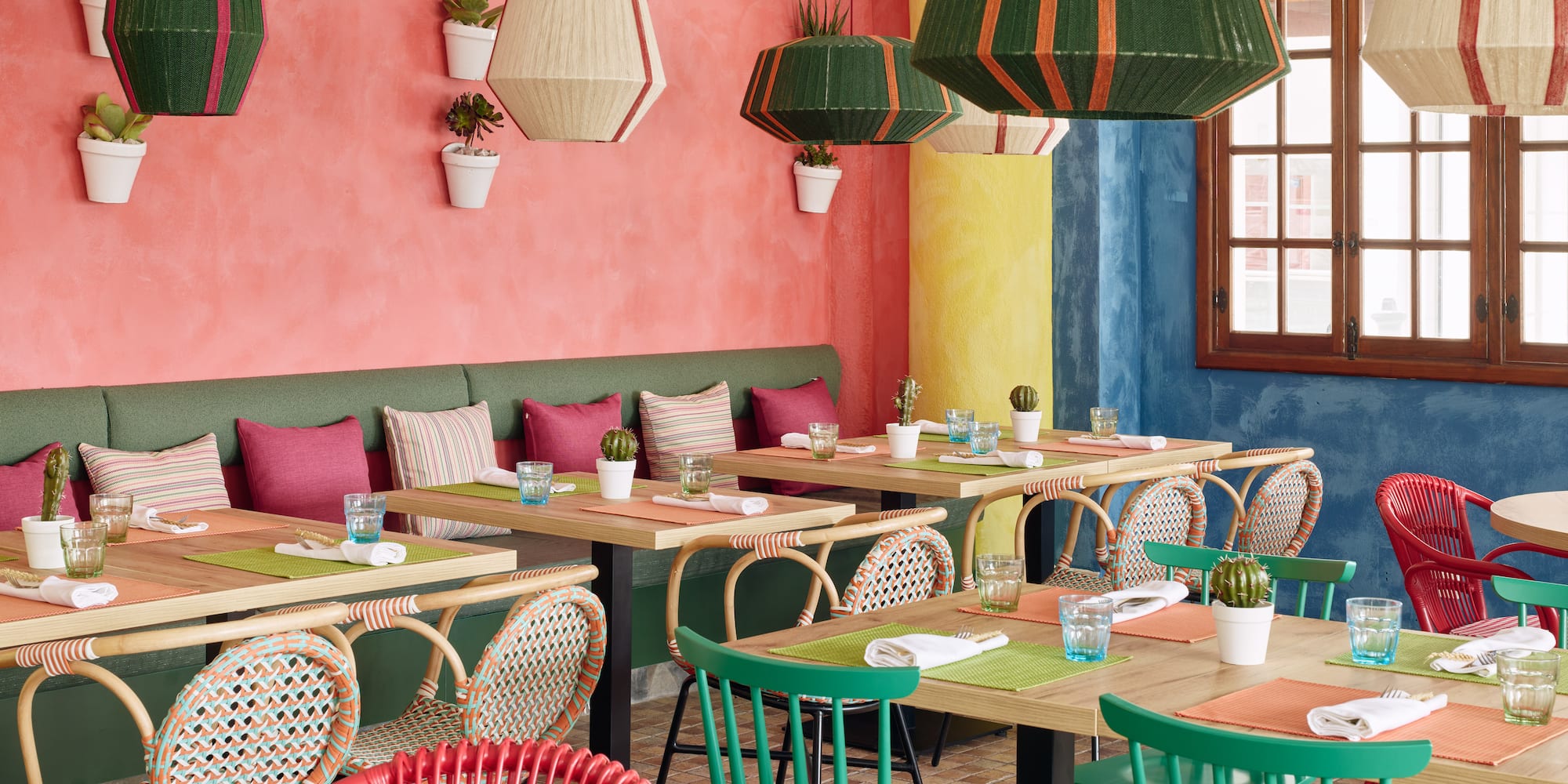 a colorful restaurant with tables and chairs
