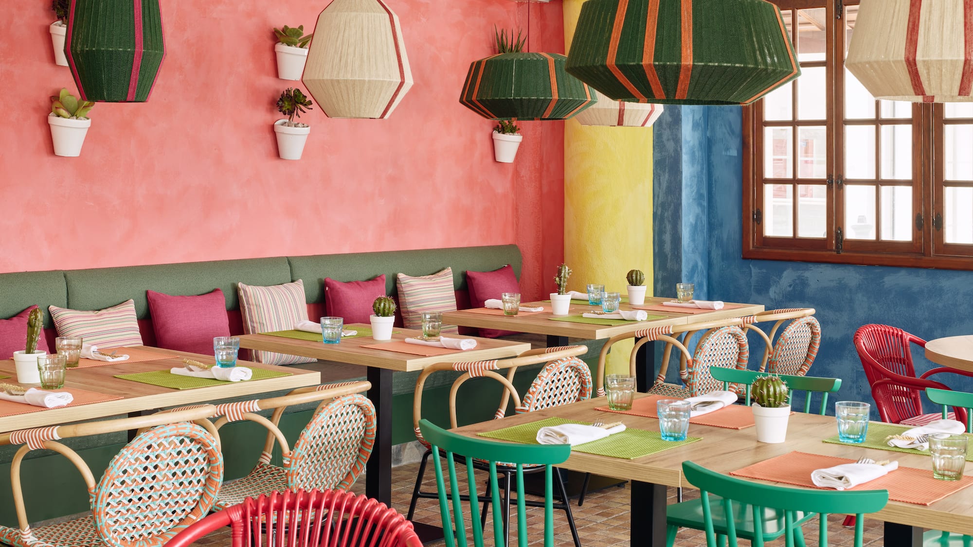 a colorful restaurant with tables and chairs