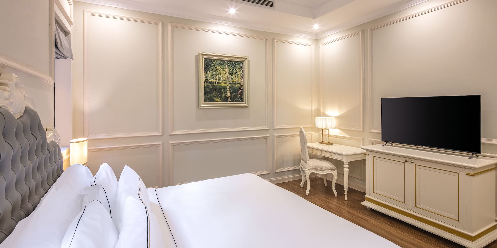 a room with a bed and a tv