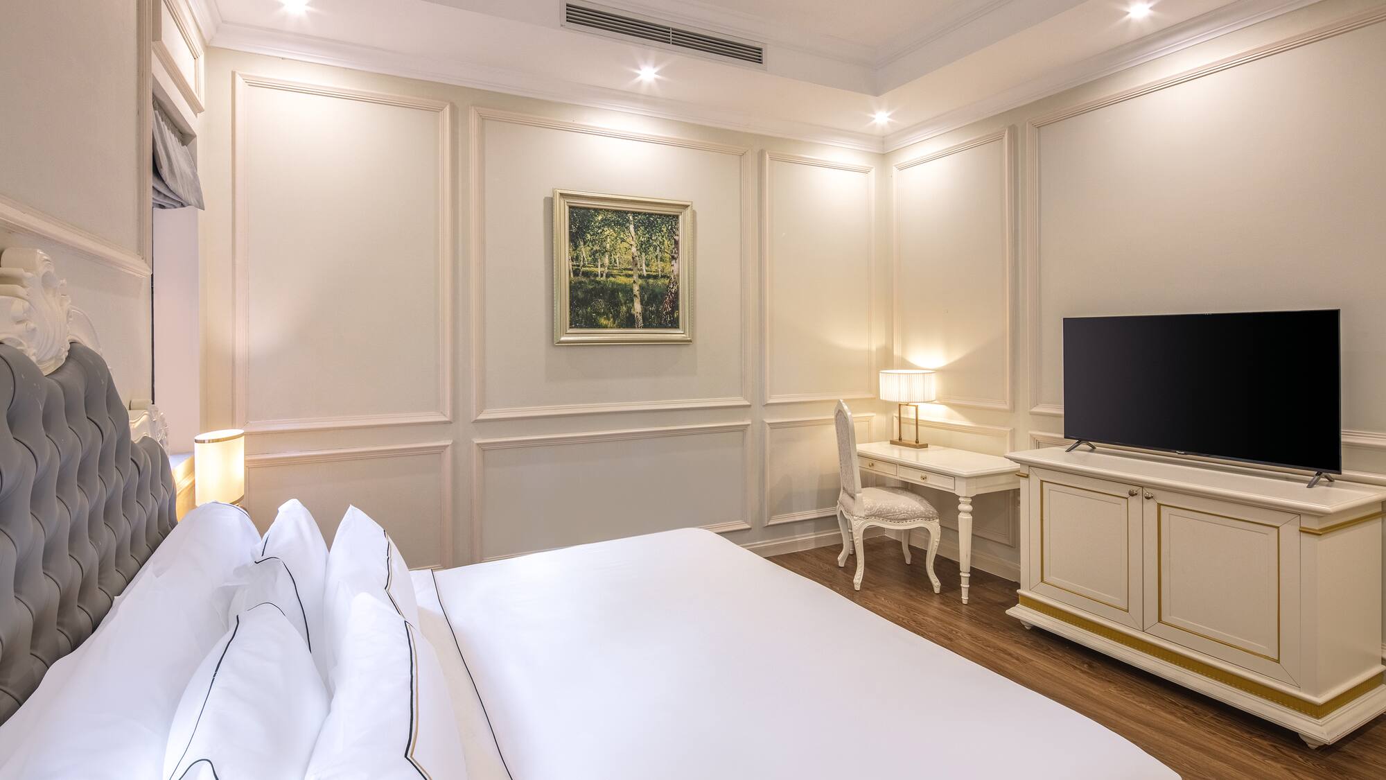 a room with a bed and a tv