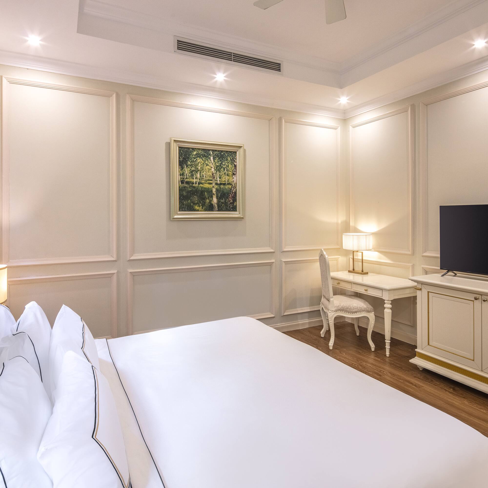 a room with a bed and a tv