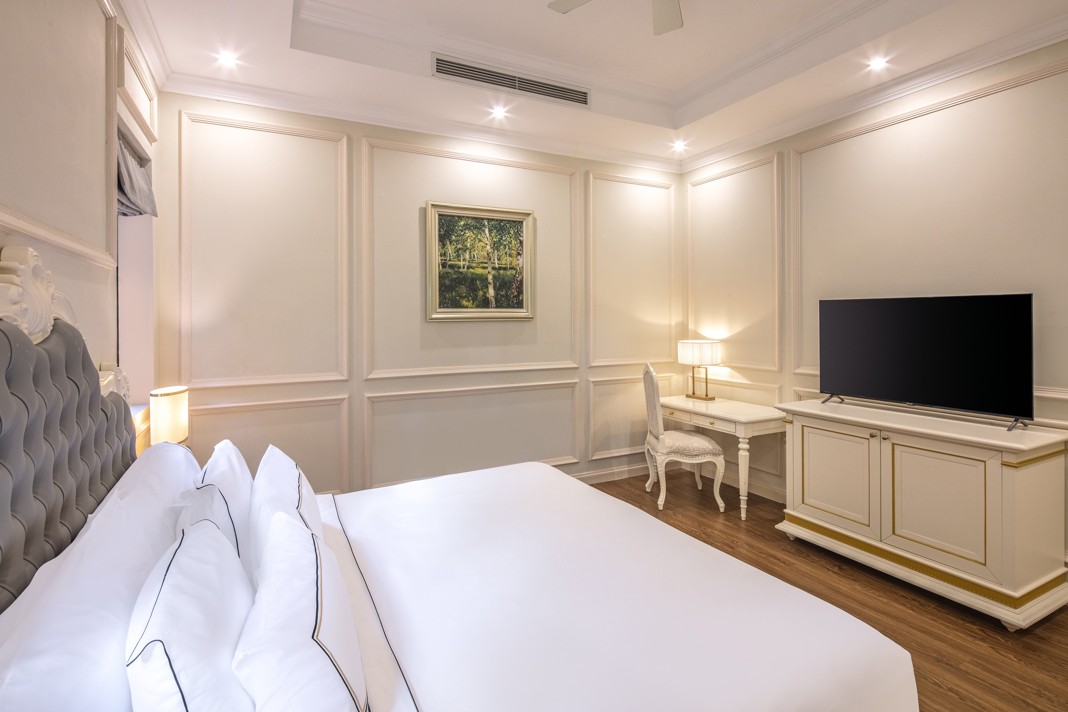 a room with a bed and a tv