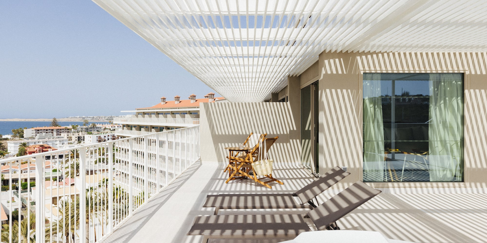 a deck with chairs and a hot tub