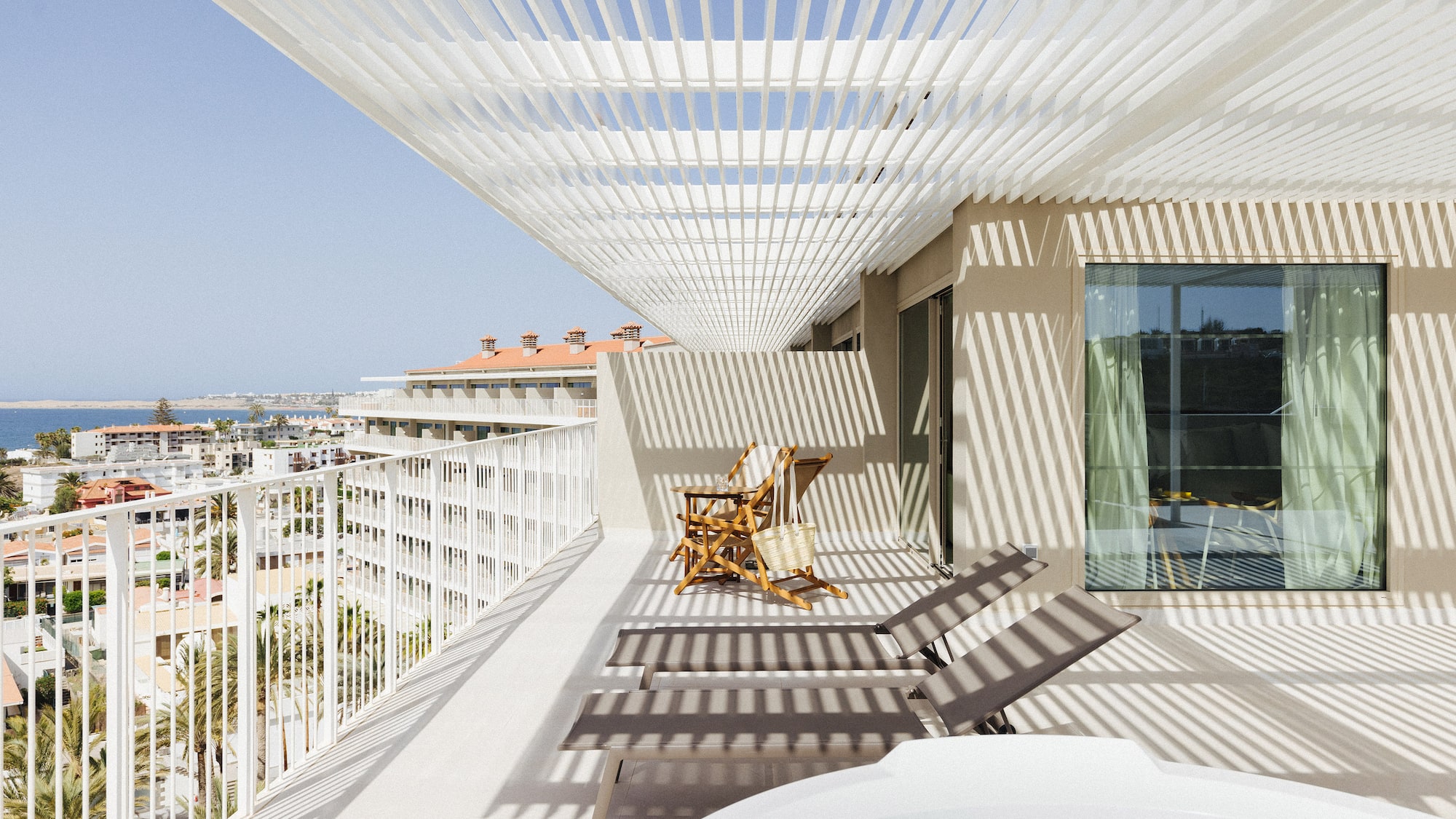 a deck with chairs and a hot tub