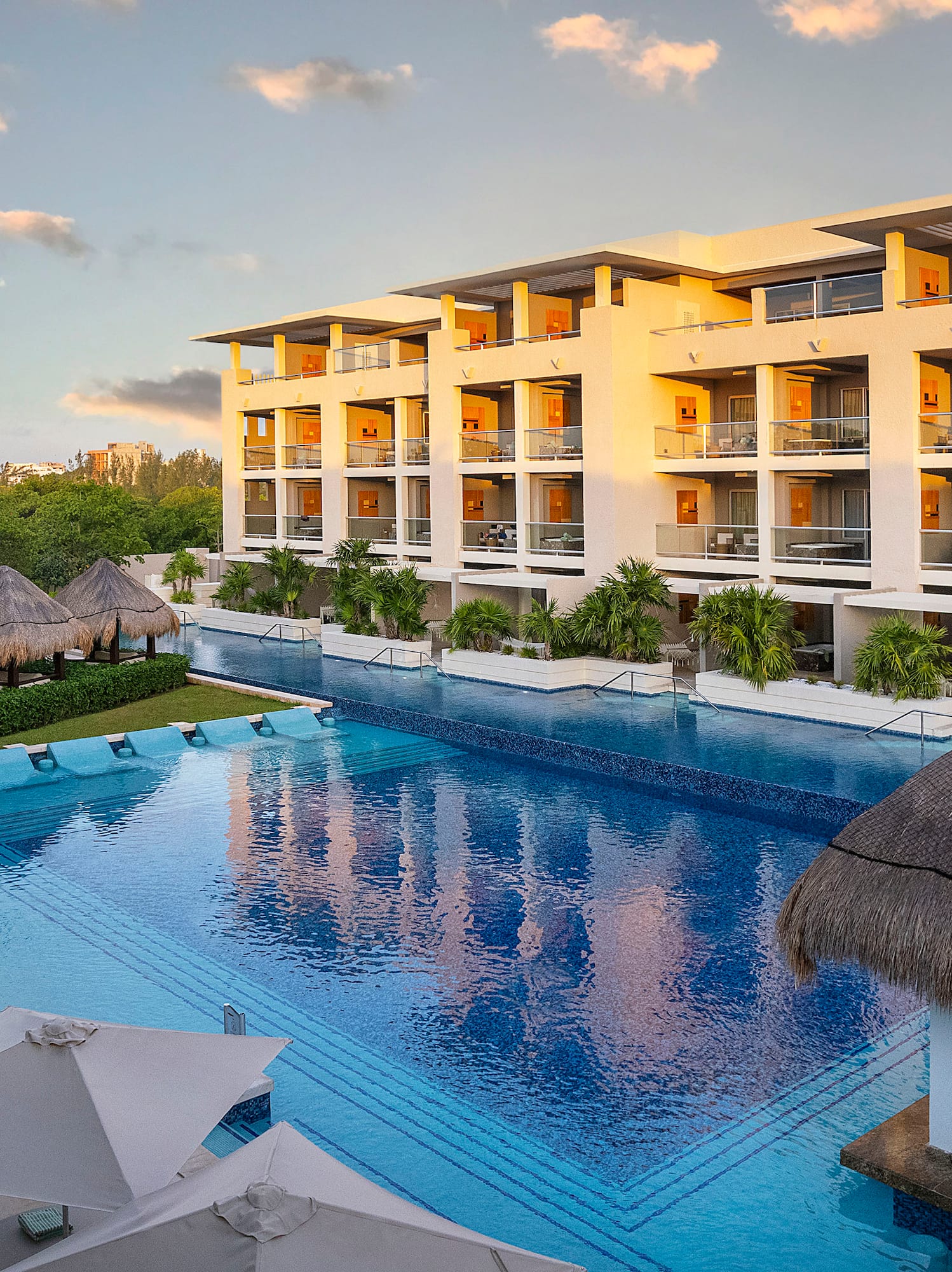 a pool with a building and trees
